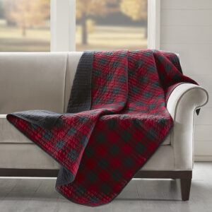 The Woolrich Tasha quilted throw features an all over black and red buffalo check and reverses to a solid black color. Made from 100% cotton this lightweight throw is soft to the touch and can be used year round.