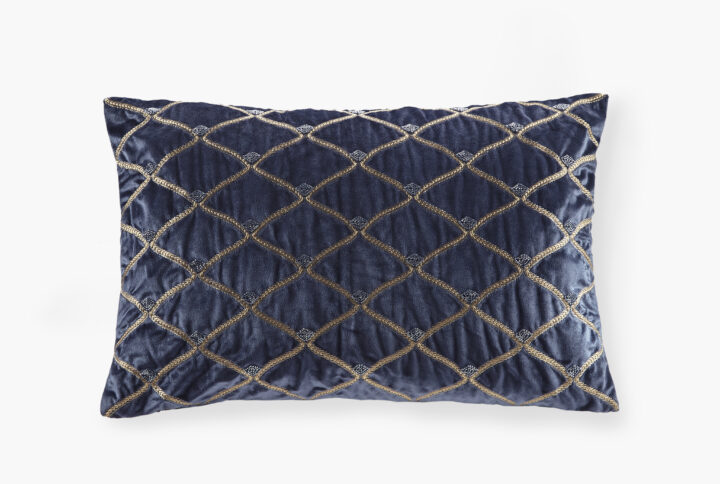 This sumptuous oblong pillow features foxtail stitched