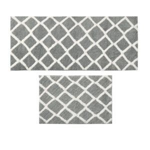 this high pile bath rug features a geometric fretwork design that flips to a classic border pattern