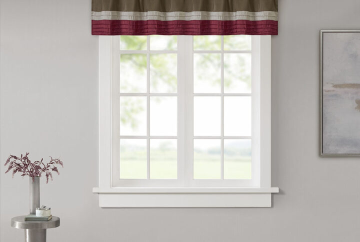 Madison Park Amherst Polyoni Pintuck Window Valance is a simple way to add style to your room. This window valance features a modern striped design in rich hues of red