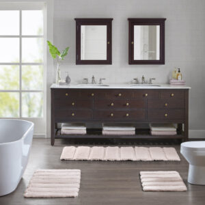 Transform your bathroom into a simple and stylish haven with our Madison Park Tufted Pearl Channel Rug. This solid tufted bath rug features a high-low stripe design with a light sheen and luster that adds rich dimension and texture for the perfect shabby chic touch your bathroom decor. Constructed from 100% macro-spun polyester fibers