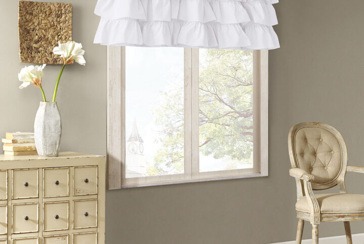 Vintage chic meets southern charm with the Madison Park Anna Window Curtain. This window panel features oversized ruffles in a crisp white hue that adds charm and sophistication to your home décor. Made from 100% cotton voile