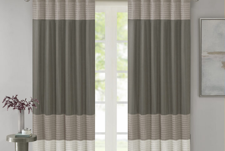 Madison Park Amherst Polyoni Pintuck Window Curtain is a simple way to add style to your room. This window panel features a modern striped design in natural hues of ivory