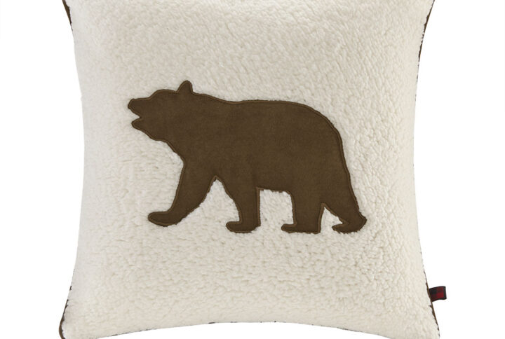 “Accent your home with the Woolrich Bear Square Berber Pillow. An applique brown bear on the face of this decorative pillow is surrounded by soft berber and reverses to a faux suede for a cozy look. The square pillow features a zipper closure that allows you to remove the cover. Filled piping on the edges creates a seamless look that adds charm and texture to your sofa or bed.”