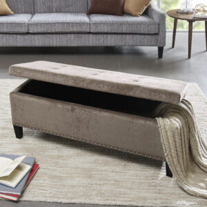 This modern storage bench accentuated with tufting provides ample storage and features an elegant blue colored soft fabric with black noir legs. Assembly Required.