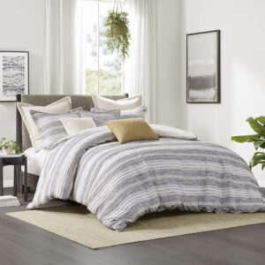 The Madison Park Signature Oasis oversized duvet-style comforter features a chenille jacquard stripe design in charcoal