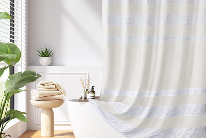 Update your space with the Madison Park Spa Waffle Shower Curtain with 3M Treatment. Featuring a fresh and updated stripe design