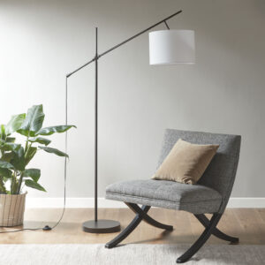 The INK+IVY Keller Adjustable Arched Floor Lamp with Drum Shade provides a sleek and simple addition to brighten up your living room. This slender metal floor lamp features a straight stand with an adjustable arm that raises and lowers the light to your desired height. The 14" linen drum shade softly filters the light to create a pleasant warm glow in your home. A black power cord completes the clean and casual design of this metal floor lamp. Use one Type A light bulb (not included).