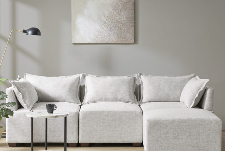 Create a comfortable seating arrangement in your living room with the modern sectional sofa chairs and ottoman. Upholstered in durable and resilient fabric