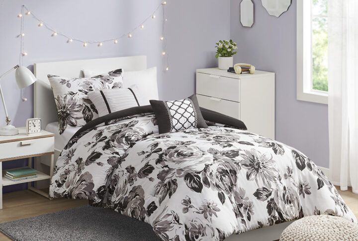 Transform your bedroom with the beautiful contrast of the Intelligent Design Dorsey Floral Print Comforter Set. The ultra-soft microfiber comforter and sham(s) flaunt a floral print in black and white for an elegant appeal. A solid black reverse on the comforter complements the top of the bed with a bold touch. Two decorative pillows with hypoallergenic filling are also included to complete the bedding set. Machine washable for easy care