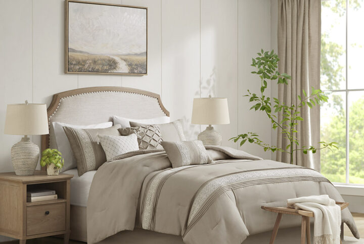 This 7 piece comforter set featuring white lace trimming and pintucks on a simple neutral ground is the perfect additional to any farmhouse or transitional bedroom. Also included are three decorative pillows featuring different techniques like pintuck