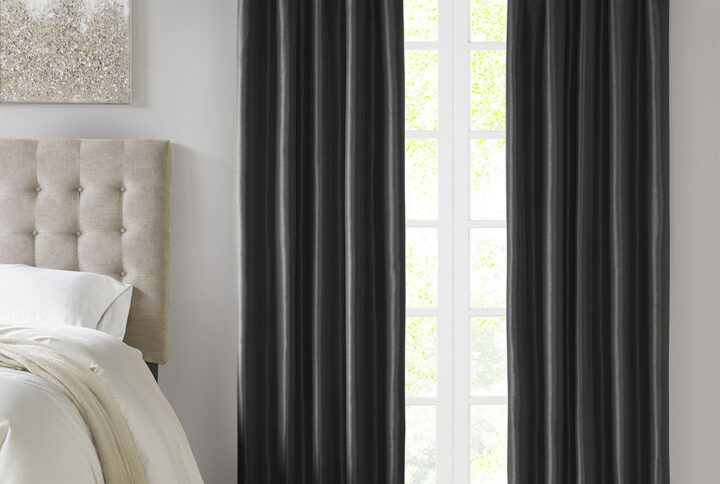 Energy efficiency meets a sophisticated style with the Madison Park Emilia Twist Tab Total Blackout Window Curtain. This window curtain panel showcases a DIY twist tab top finish that allows you to create an elegant display in your living room or bedroom space. The faux silk sheen base fabric features a 3 pass foamback liner on the reverse to block out all outside light