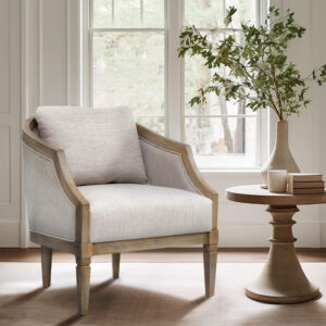 Introducing the Whitney Accent Chair from Martha Stewart's Bedford Collection. This armchair embodies classic sophistication and is the perfect addition to any room. Its wooden frame beautifully accentuates the graceful curvature of the back and scoop arms. Crafted with a solid wood frame in a reclaimed natural finish