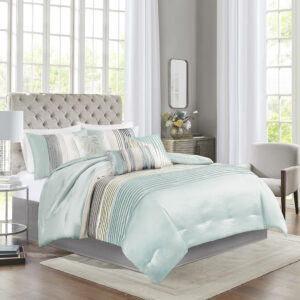 Amherst's modern color blocked design is a simple way to add style to your room. This comforter is covered in larges stripes in shades of aqua and grey. Made from polyester jacquard and a brushed fabric reverse this comforter is soft to the touch and is machine washable for easy care. The comforter set includes two matching standard shams and three decorative pillows that accent the color blocked look.