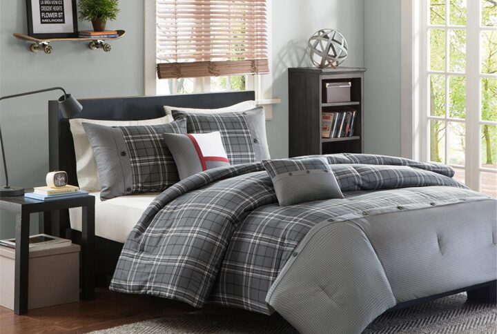 The Intelligent Design Daryl Comforter Set combines modern design with classic colors to create a sharp look. This comforter features a grey and white plaid print with a pieced design at the foot that is accented with button detailing. The 2 matching shams (1 in Twin/TwinXL) mirror the pieced look of the comforter