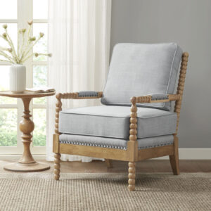 The Madison Park Donohue Accent Chair provides an elegant and comfortable update to your decor. This accent chair is upholstered in a dusty blue fabric that creates a timeless look. A bronze nail head trim and padded arm rests add the perfect touches to the design. The solid wood legs feature a camel oak wood finish to complement the rich upholstery. Beautifully designed