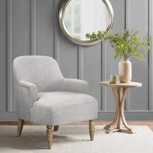 Add refined elegance to your living room with the Martha Stewart Jada Accent Chair. This transitional style accent chair features flared arms and a wide seat to create a unique and charming silhouette that complements most home decors. The thick upholstered seat provides exceptional comfort