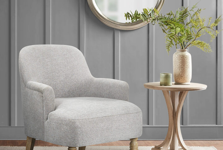 Add refined elegance to your living room with the Martha Stewart Jada Accent Chair. This transitional style accent chair features flared arms and a wide seat to create a unique and charming silhouette that complements most home decors. The thick upholstered seat provides exceptional comfort