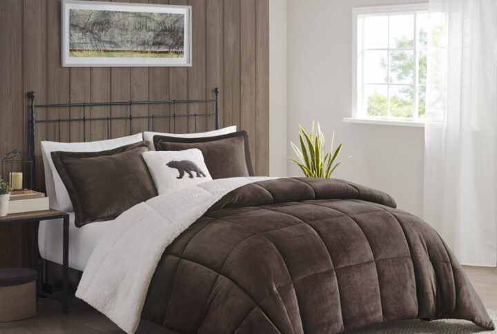 Bring the warmth and comfort of a cabin retreat to your bedroom with the Woolrich Alton Plush to Sherpa Down Alternative Comforter Set. Made from ultra-soft plush and reversing to a cozy berber