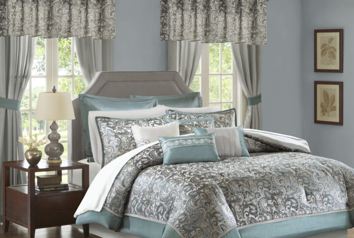 The Madison Park Essentials Brystol 24 Piece Room in a Bag provides a total makeover for your bedroom decor. This traditional comforter flaunts a teal and grey jacquard paisley pattern with an accenting solid teal border to create a luxurious glam look. Matching pillow shams and solid teal Euro shams with 2-inch flanges coordinate beautifully with the elegant comforter. A solid grey bed skirt and 4 decorative pillows with embroidery and pleating details add the finishing touches to this paisley bedding set. Hypoallergenic polyester filling in the comforter and pillows contains no allergens and is treated to be dustproof. A 4 Piece sheet set is also included to complement the comforter and complete the jacquard bedding set. To elevate your bedroom