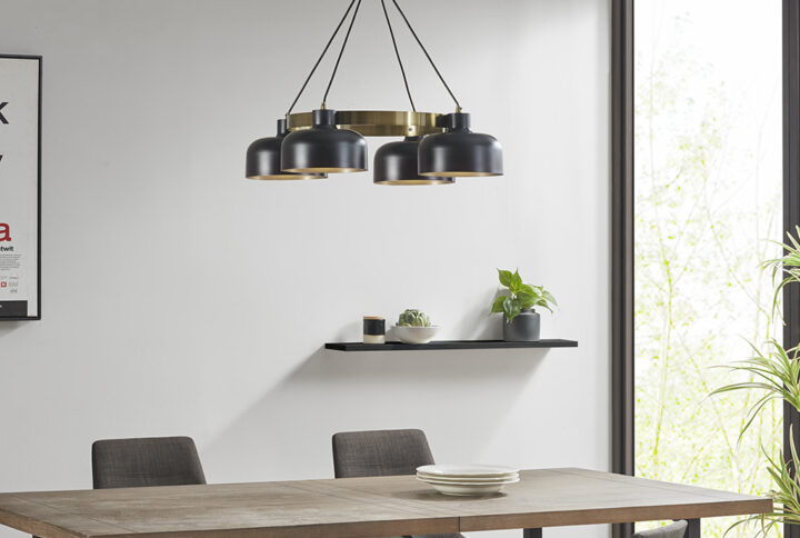 The INK+IVY Abbott 4-Light Metal Shade Chandelier offers a bold and sophisticated update to your home. This chandelier features 4 downward lights in black bowl-shaped shades around the edge of a center gold ring to create a striking contrast. The down rod includes 3 piece extension rods with 2 that measure 12" and 1 that measure 6"