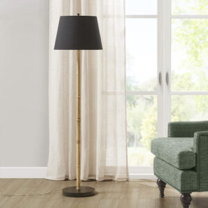 This 60"H Nassau Metal Bamboo Floor Lamp is inspired by Martha Steward's shingle-style beach home and is part of Martha Stewart's Lily Pond collection. The lamp features a bamboo design with a contrasting black base and tapered drum shade. It's made from durable metal and has an on/off switch inline. The 72-inch clear colored cord plugs into an outlet