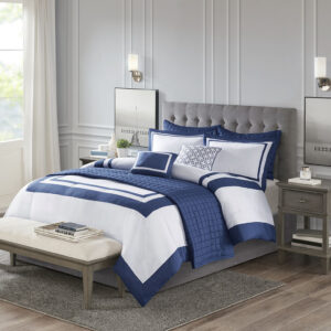 This Heritage hotel bedding collection includes a comforter and quilt that both come with matching shams to complete a luxurious layered look. The soft comforter and shams showcase a bold border on a white ground with a solid white reverse