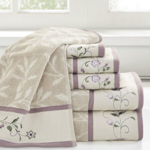 Add a touch of elegance to your bathroom decor with our Madison Park Serene Embroidered Cotton Jacquard 6 Piece Towel Set. These cotton towels feature a jacquard leaf pattern with a floral embroidered hem