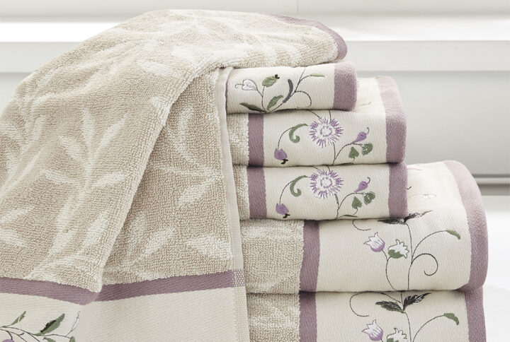 Add a touch of elegance to your bathroom decor with our Madison Park Serene Embroidered Cotton Jacquard 6 Piece Towel Set. These cotton towels feature a jacquard leaf pattern with a floral embroidered hem