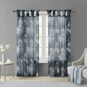 The Madison Park Simone Printed Floral Twist Tab Top Voile Sheer brings a soft and romantic touch to your home decor. This voile sheer curtain panel features a beautiful blush and neutral printed floral on a dark navy ground for a rich and stylish contrast