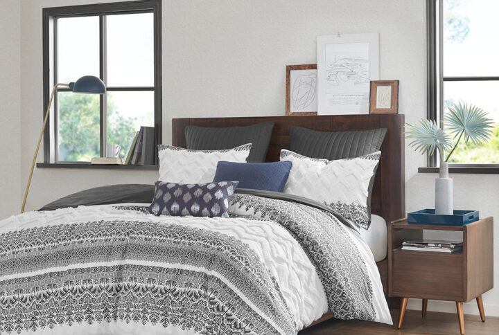 Transform your bedroom with the charming shabby chic allure of the INK+IVY Mila 3 Piece Cotton Duvet Cover Set with Chenille Tufting. The cotton duvet cover flaunts an updated gray botanic print