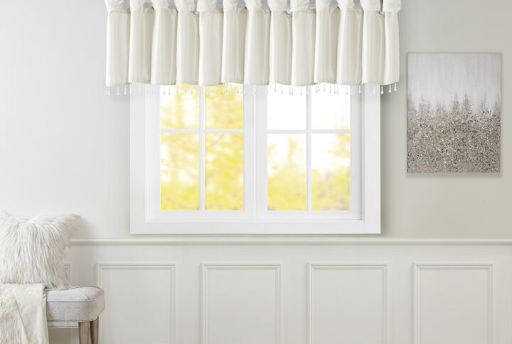 Give your home a decorator’s touch with the Madison Park Emilia Window Valance. Made from a faux silk fabric