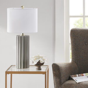 The Martha Stewart Glendale Ribbed Ceramic Table Lamp blends classic and contemporary styles to update your home decor. This ceramic table lamp showcases a ribbed fluted modern design with a Grey finish