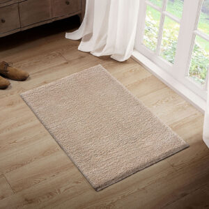 The Madison Park Camdyn Super Soft Polyester Shag Area Rug offers a chic modern addition to your living space. This solid cream shag area rug flaunts a super soft