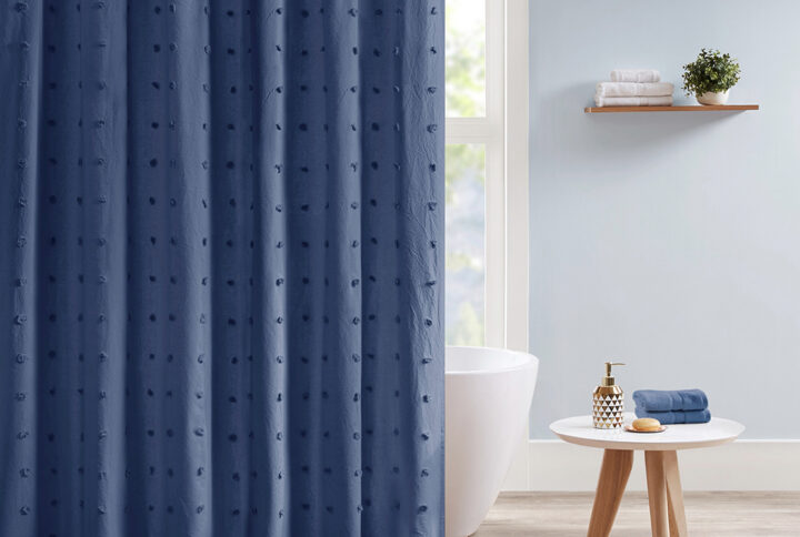 Create a shabby chic look in your bathroom with the Urban Habitat Brooklyn Cotton Yarn Dyed Jacquard Pom Pom Shower Curtain. This 100% cotton shower curtain features a soft indigo blue hue with an all-over pom pom tuft design that creates a beautiful texture and fresh tonal pattern. Measuring 70x72 inches