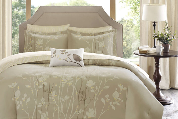 Madison Park Essentials Vaughn Complete Comforter and Cotton Sheet Set brings luxury and beauty to any bedroom. This taupe comforter is covered in elegant white and brown floral tree branches with subtle yellow details. This complete bed set includes matching shams