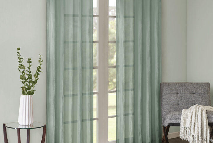 Add a fresh contemporary style to your home with Madison Park’s Harper Solid Crushed Window Panel Pair. Made from a lightweight aqua sheer fabric