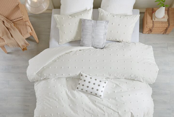 The Urban Habitat Brooklyn Cotton Jacquard Duvet Cover Set features small tufted chenille dots that create a fresh shabby chic look. This duvet cover set brings a soft and charming update to your bedroom