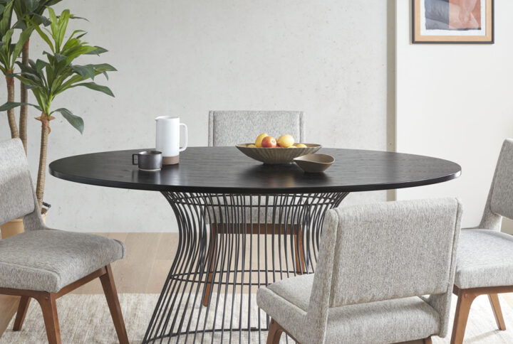 Add mid century modern to your dining room with the INK+IVY Mercer oval dining table. Inspired by the iconic 60's silhouette with a modern twist of black tops and antique black wire frames for an updated look. Seats 6. Table will be shipped in 2 cartons. Assembly required.