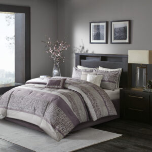 Give your bedroom a new luxurious look with the Madison Park Rhapsody 7 Piece Jacquard Comforter Set. This jacquard comforter features a purple and grey stripe design of several different motifs on the face with a solid beige reverse