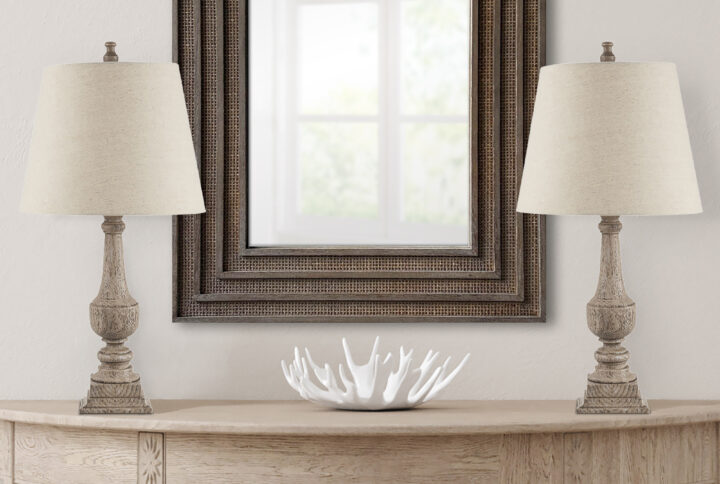 Experience timeless elegance with the Martha Stewart Lily Pond Collection: the Provencal Faux Wood Table Lamp Set is a true emblem of classic style with its refined turn and step details in a reclaimed grey finish. Crafted meticulously from resin