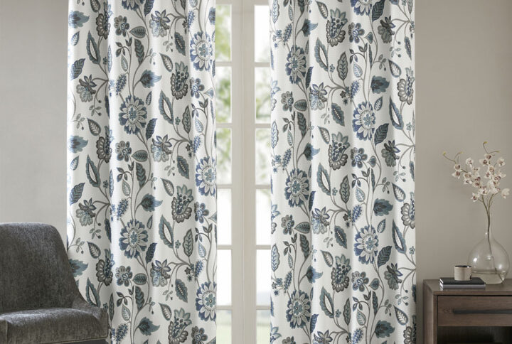 Beautifully frame your window with the stylish and functional SunSmart Camille Printed Room Darkening Curtain. A floral design in deep aqua