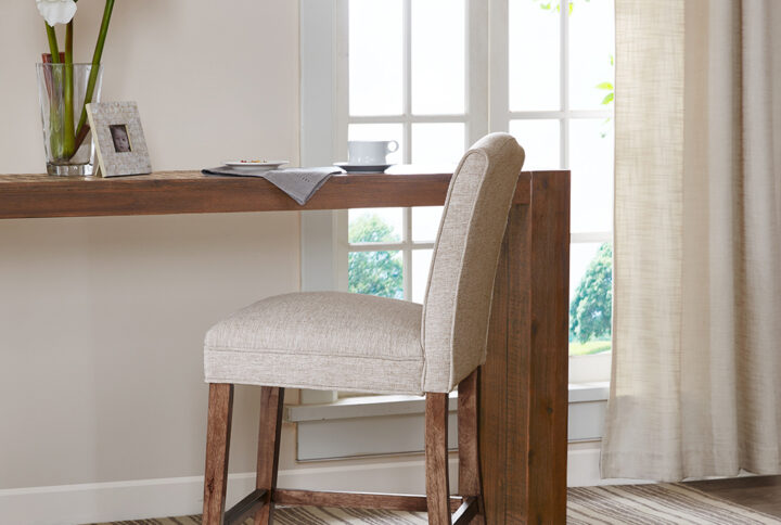 This sophisticated camel back counter stool adds the perfect touch to any counter or bar area. Assembly required.