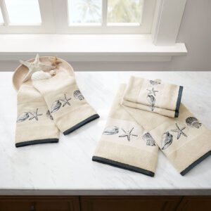 Complete the beach look of your bathroom our Madison Park Bayside Embroidered Cotton Jacquard 6 Piece Towel Set. This solid natural textured jacquard towel set features a stylish hem highlighted by an embroidered coastal motif of blue sea shells and starfish