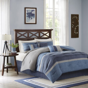 Create a warm update to your space with the Madison Park Collins Collection. This pieced suede comforter features shades of navy