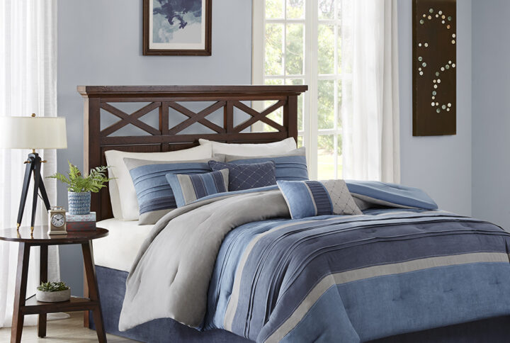 Create a warm update to your space with the Madison Park Collins Collection. This pieced suede comforter features shades of navy