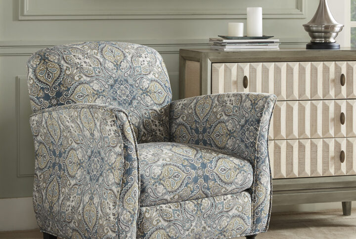 The Madison Park Escher Accent Chair brings a touch of elegance to your home decor. This accent chair is upholstered in a printed fabric and features flared arms that create a sharp transitional look. The solid wood legs provide a sturdy base