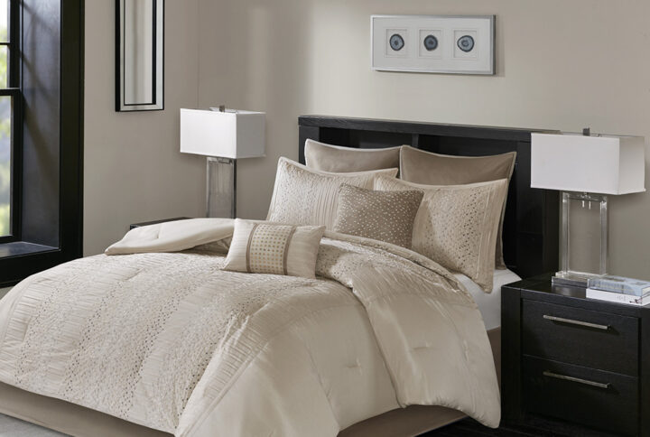 Update your bedroom with the Madison Park Camelia 8 Piece Embroidered Comforter Set. The faux silk pieced comforter and shams flaunt a geometric embroidery design that adds charm and texture to the top of the bed. Two polyoni Euro shams provide a rich color to the bedding set