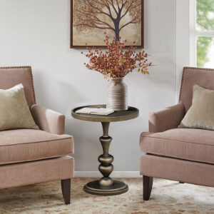 The Madison Park Del Mar pedestal accent table brings a refined addition to your home decor. This round table features an elegant turned pedestal base and a tray table top with a raised edge that helps prevent items from falling off. The bronze finish creates a stunning transitional glam look that elevates your space. Perfectly sized for small spaces