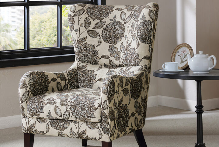 The Madison Park Arianna Swoop Wing Chair offers a unique style and comfort to elevate your home decor. This chic transitional accent chair features a high